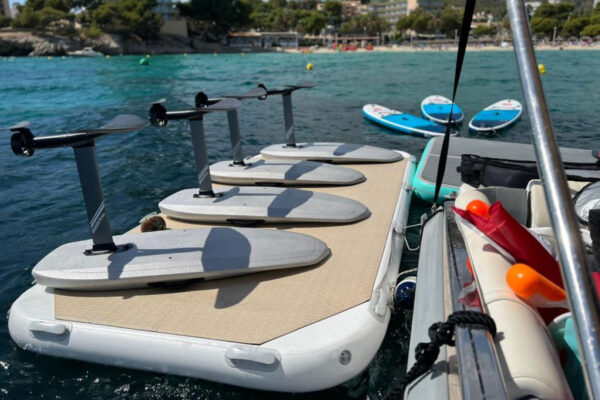 Inflatable Platform at sea for rent with 4 e-foils on a sunny day
