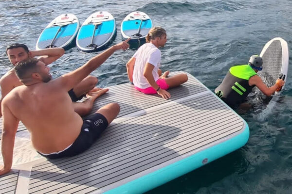 Inflatable Sea Water Platform for rent with 3 people on it