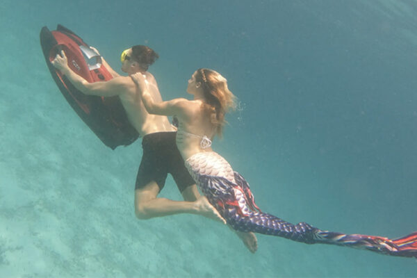 iAQUA underwater scooter couple cruising together underwater