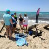 group of attendees at the beach in the wave lovers e-foil academy