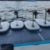 Inflatable Platform at sea for rent with 4 e-foils on a sunny day