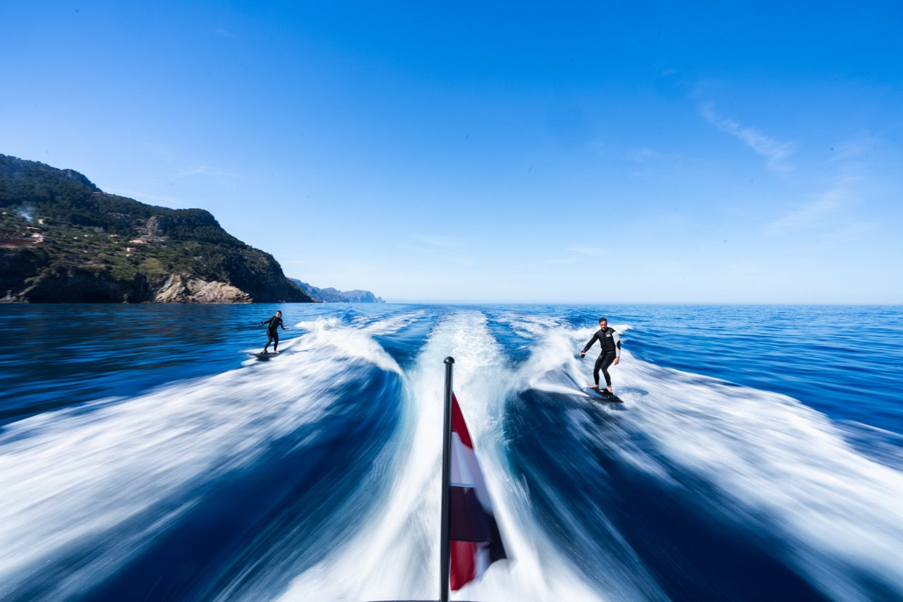 Awake RÄVIK Adventure Electric Surfboard Surfing Behind Boat